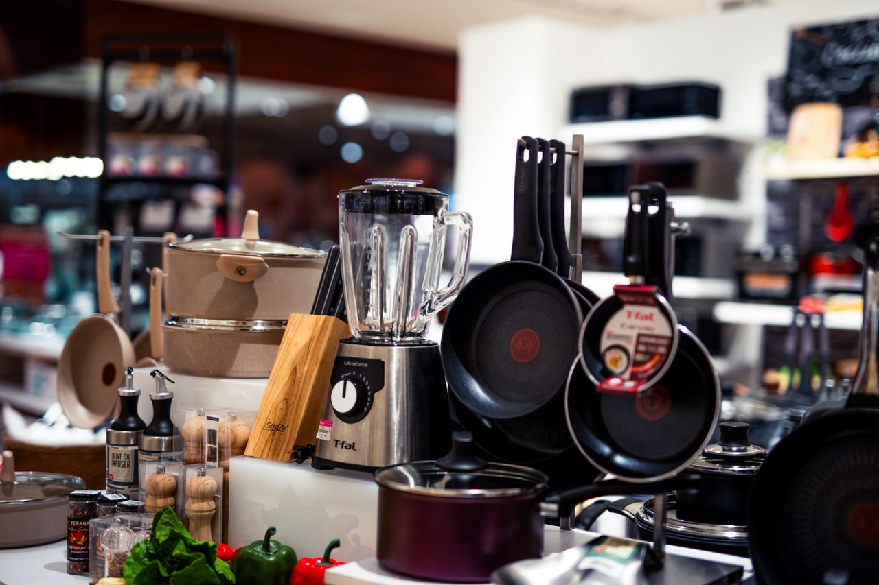 services-02 A vibrant selection of modern kitchen utensils including pans, blenders, and accessories.